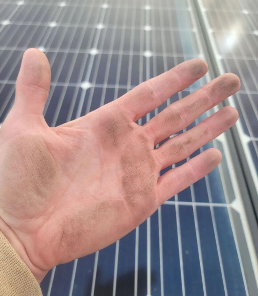 hand-dirty-from-solar-panel